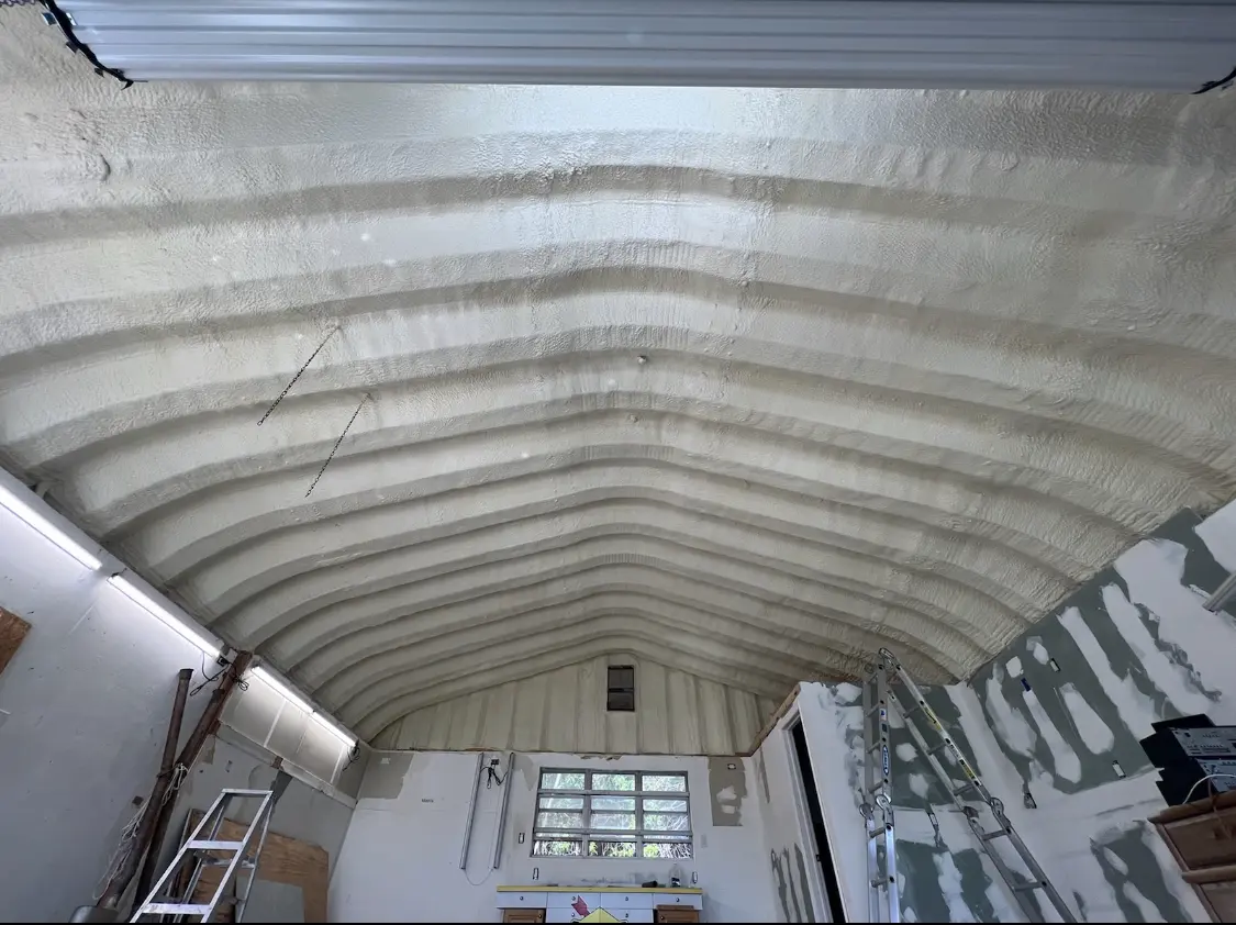 Spray polyurethane foam applied to the underside of a metal roof deck in Emmaus